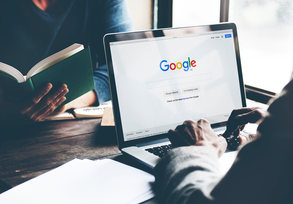 How Phoenix SEO Companies Enhance Local Search Results 9 a person using a laptop